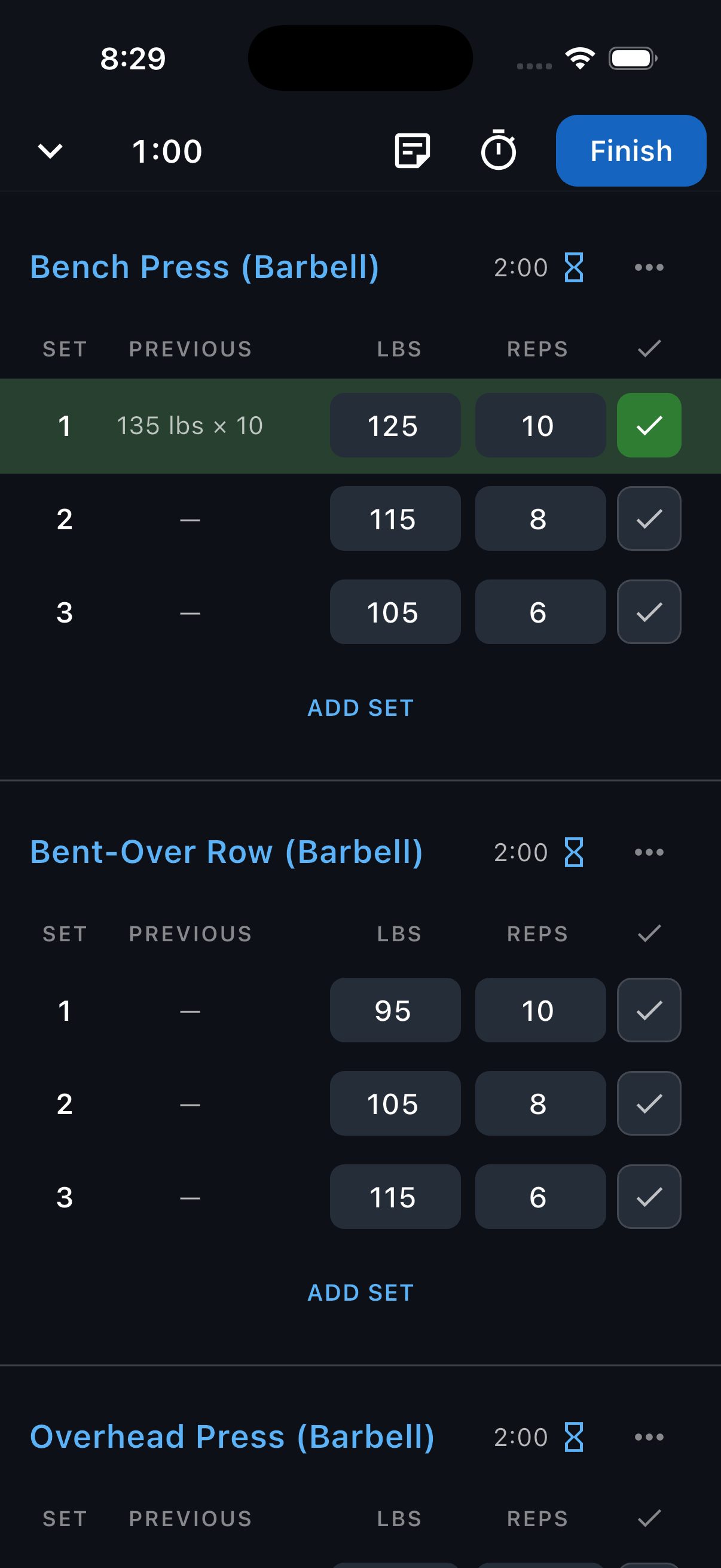An active workout with Bench Press, Bent-Over Row, and Overhead Press, with the completed-set checkmark highlighted.